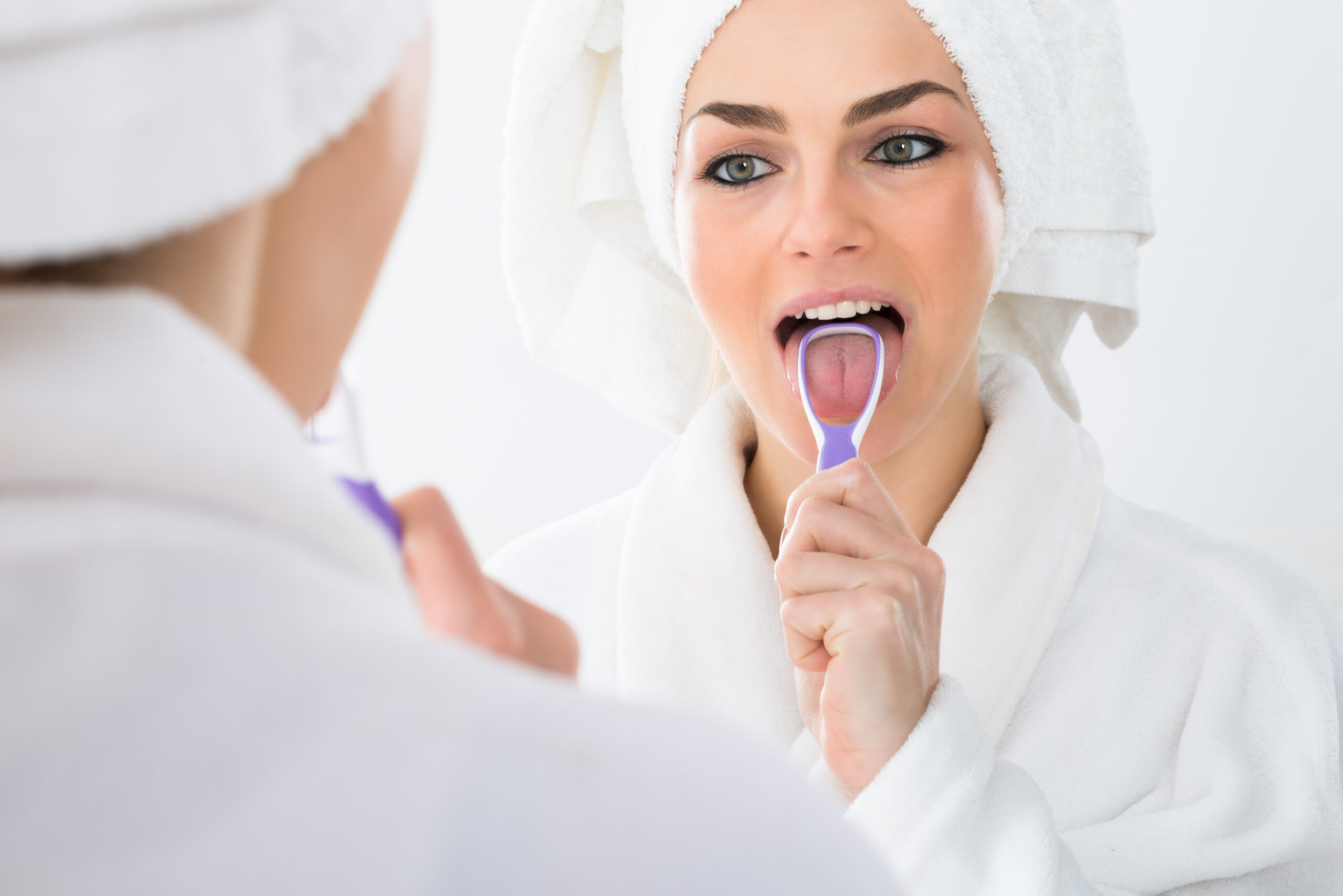 Should I Be Using a Tongue Scraper? | Restorative Dentist Near Me